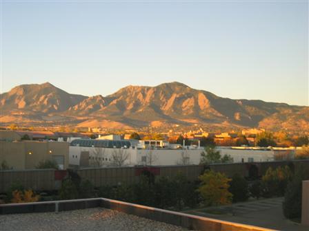 Sunrise on the Flatirons from behind Yves' office window